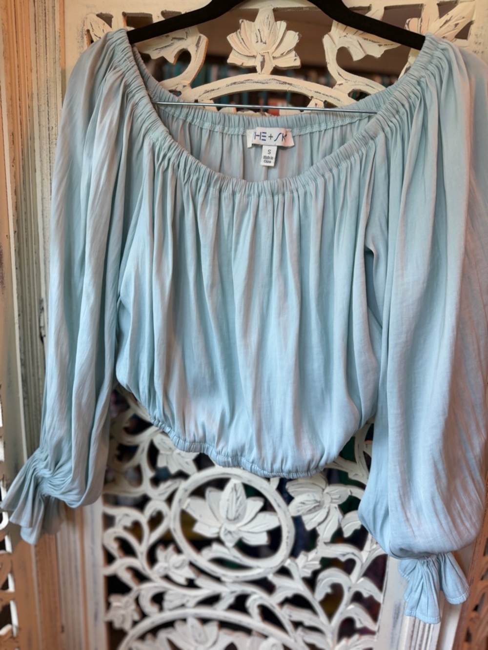She+sky Light Blue Off-Shoulder Peasant Blouse with stretchy fitted bottom hem.